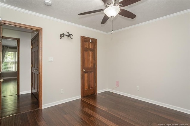 5621 Monks Walk Ct, Fayetteville, NC 28311 - unfurnished room with dark wood finished floors, crown molding, a ceiling fan, a textured ceiling, and a smoke detector