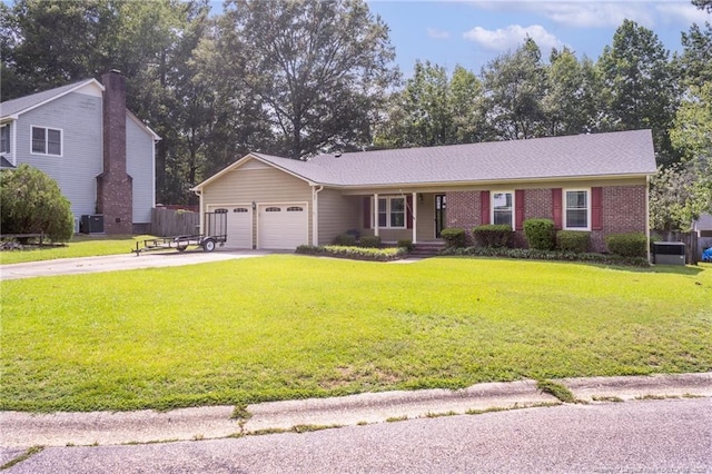 5621 Monks Walk Ct, Fayetteville, NC 28311 - view of front facade featuring concrete driveway, a garage, a front lawn, a porch, and brick siding