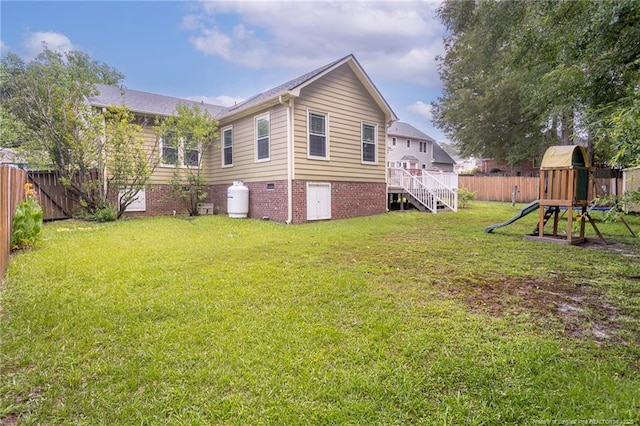 5621 Monks Walk Ct, Fayetteville, NC 28311 - back of house featuring a fenced backyard and a playground