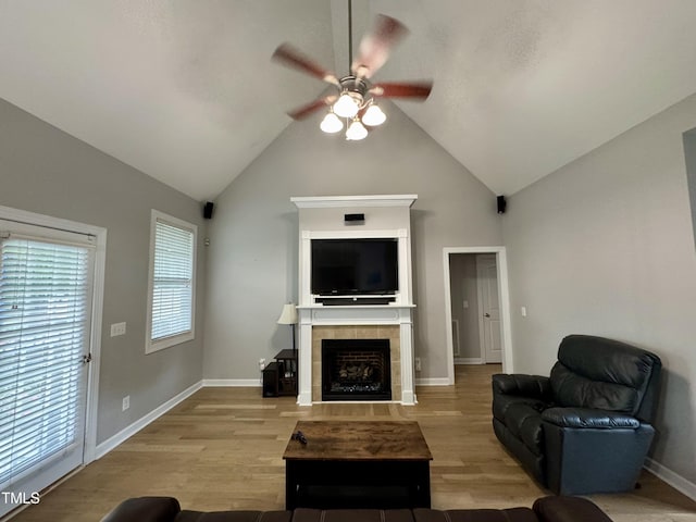 71 Beaver Creek Dr, Dunn, NC 28334 - living area with ceiling fan, a tile fireplace, wood finished floors, and high vaulted ceiling