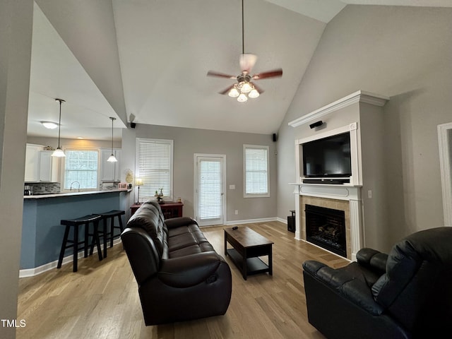 71 Beaver Creek Dr, Dunn, NC 28334 - living area featuring ceiling fan, light wood-style floors, healthy amount of natural light, and high vaulted ceiling