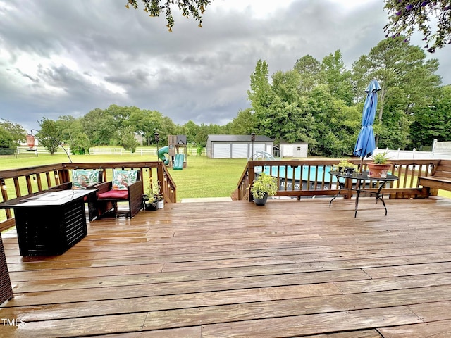 71 Beaver Creek Dr, Dunn, NC 28334 - deck featuring a storage shed and a lawn