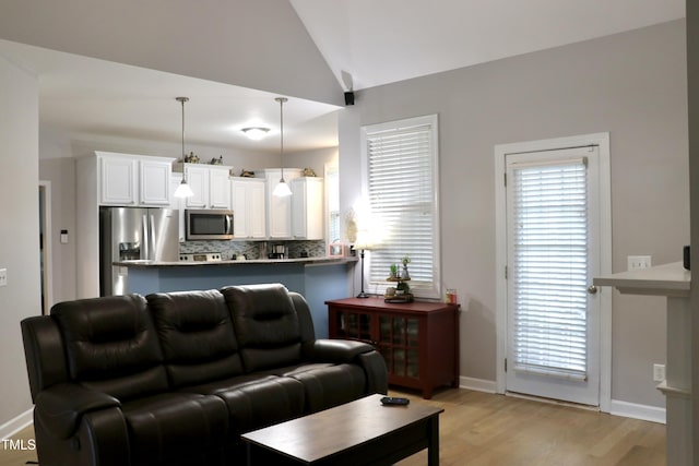 71 Beaver Creek Dr, Dunn, NC 28334 - living area with light wood-style floors and vaulted ceiling