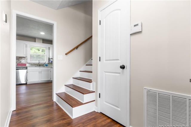 1524 Stackhouse Dr, Fayetteville, NC 28314 - stairway with wood finished floors