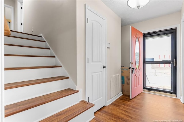 1524 Stackhouse Dr, Fayetteville, NC 28314 - entryway with wood finished floors and stairs