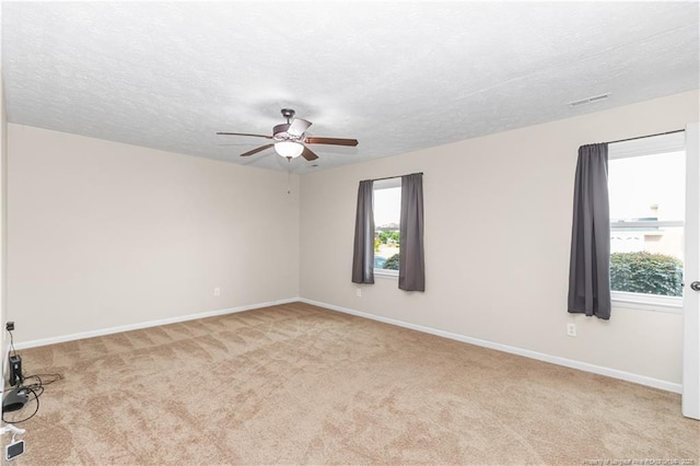 1524 Stackhouse Dr, Fayetteville, NC 28314 - carpeted empty room with ceiling fan and a textured ceiling