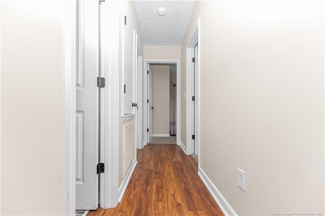 1524 Stackhouse Dr, Fayetteville, NC 28314 - hall featuring wood finished floors and a textured ceiling