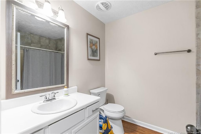 1524 Stackhouse Dr, Fayetteville, NC 28314 - full bathroom featuring vanity, wood finished floors, and a shower with shower curtain