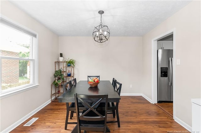 1524 Stackhouse Dr, Fayetteville, NC 28314 - dining room with a chandelier and dark wood-type flooring