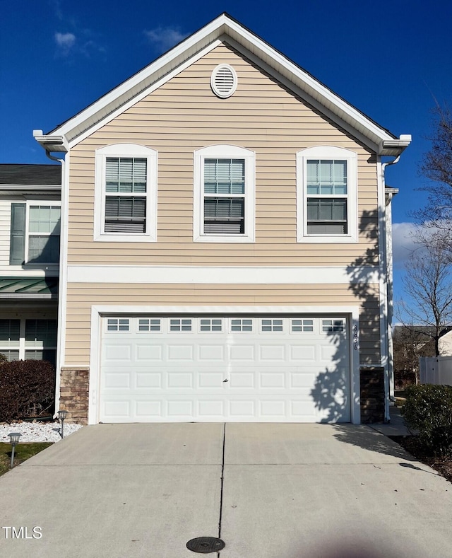 8836 Thornton Garden Ln, Raleigh, NC 27616 - traditional-style home featuring driveway and an attached garage