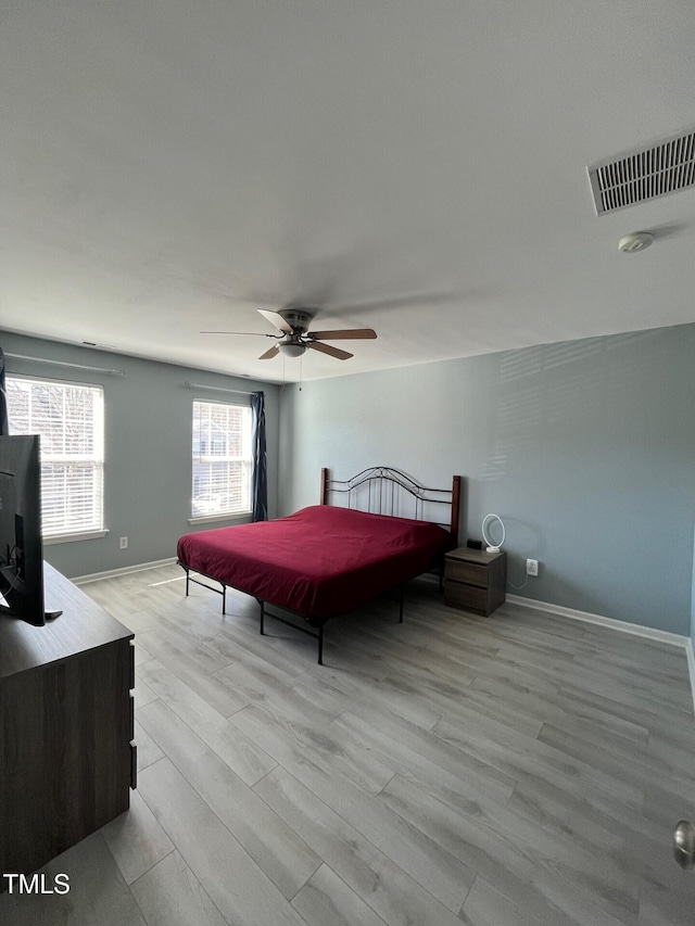 8836 Thornton Garden Ln, Raleigh, NC 27616 - bedroom with light wood finished floors and a ceiling fan