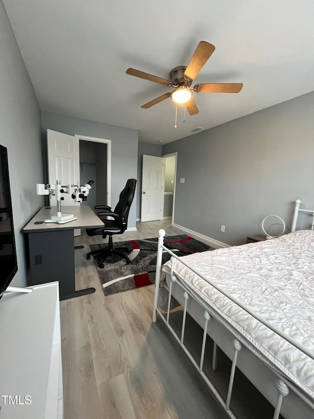 8836 Thornton Garden Ln, Raleigh, NC 27616 - bedroom with light wood finished floors and ceiling fan