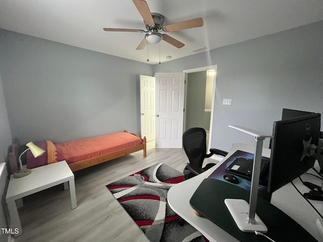 8836 Thornton Garden Ln, Raleigh, NC 27616 - bedroom featuring wood finished floors, a desk, and ceiling fan
