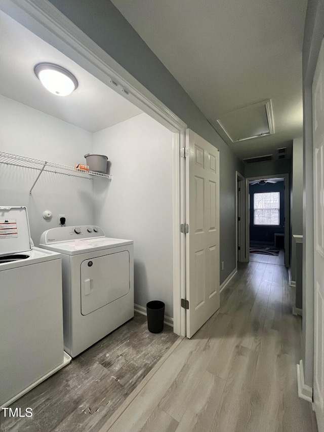 8836 Thornton Garden Ln, Raleigh, NC 27616 - laundry area featuring washer and dryer and wood finished floors