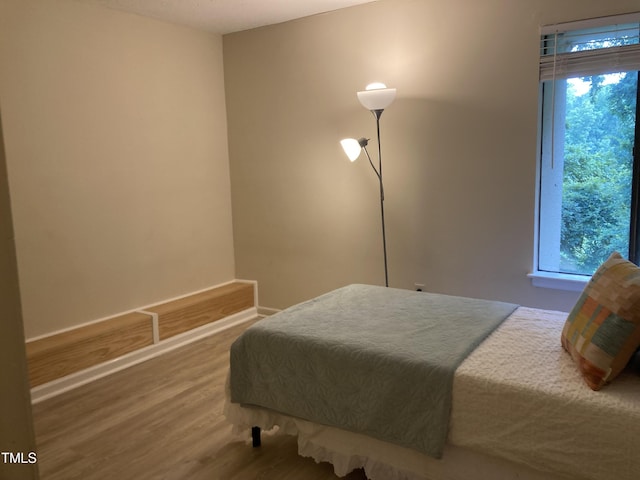 500 Umstead Dr Unit D307, Chapel Hill, NC 27516 - bedroom featuring multiple windows and wood finished floors
