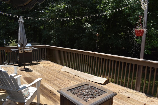 9 Pinecourt Dr, Siler City, NC 27344 - wooden terrace featuring an outdoor fire pit and grilling area