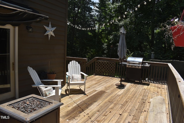 9 Pinecourt Dr, Siler City, NC 27344 - wooden deck featuring an outdoor fire pit and a grill