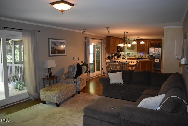 9 Pinecourt Dr, Siler City, NC 27344 - living room featuring dark wood finished floors and crown molding