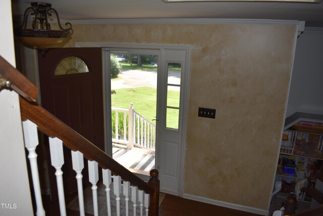 9 Pinecourt Dr, Siler City, NC 27344 - foyer entrance with plenty of natural light, crown molding, and stairs