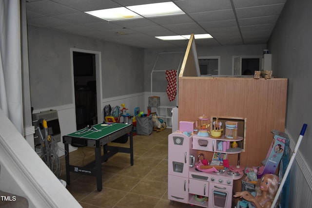 9 Pinecourt Dr, Siler City, NC 27344 - playroom with tile patterned flooring, wainscoting, and a paneled ceiling