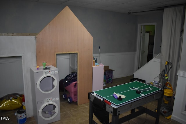 9 Pinecourt Dr, Siler City, NC 27344 - game room with stacked washer / dryer and tile patterned floors