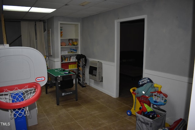 9 Pinecourt Dr, Siler City, NC 27344 - recreation room featuring heating unit, tile patterned flooring, wainscoting, and a drop ceiling