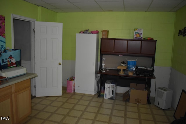 9 Pinecourt Dr, Siler City, NC 27344 - kitchen featuring concrete block wall, light flooring, and light countertops