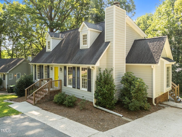 3309 Bearskin Ct, Raleigh, NC 27606 - cape cod home featuring a shingled roof and a chimney