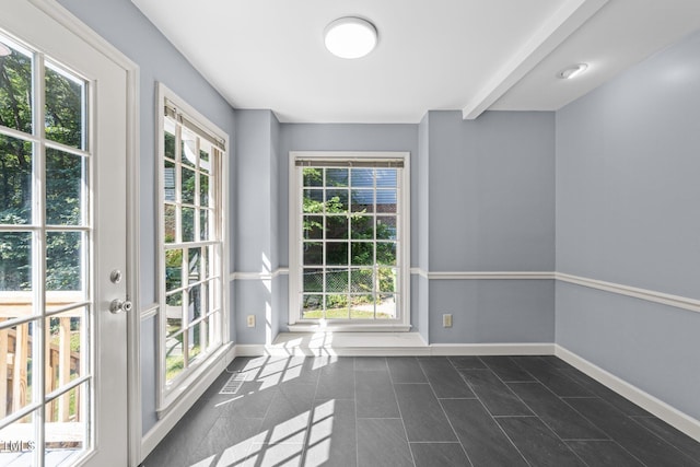3309 Bearskin Ct, Raleigh, NC 27606 - doorway with baseboards and dark tile patterned floors