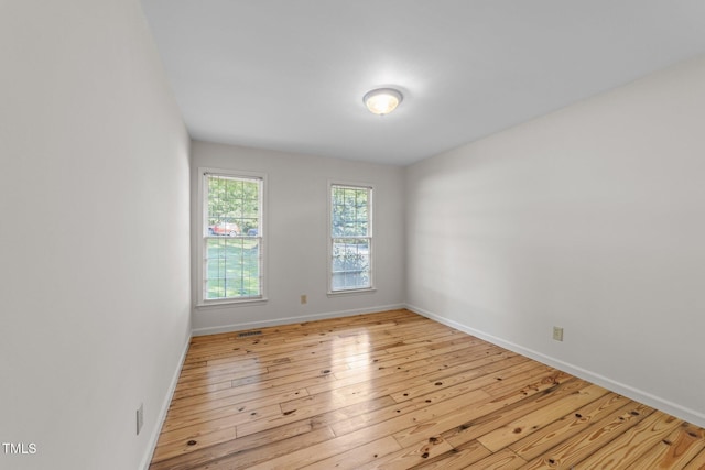 3309 Bearskin Ct, Raleigh, NC 27606 - unfurnished room featuring hardwood / wood-style floors and baseboards
