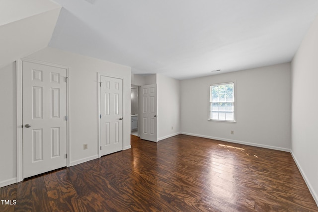 3309 Bearskin Ct, Raleigh, NC 27606 - unfurnished bedroom with wood finished floors and baseboards