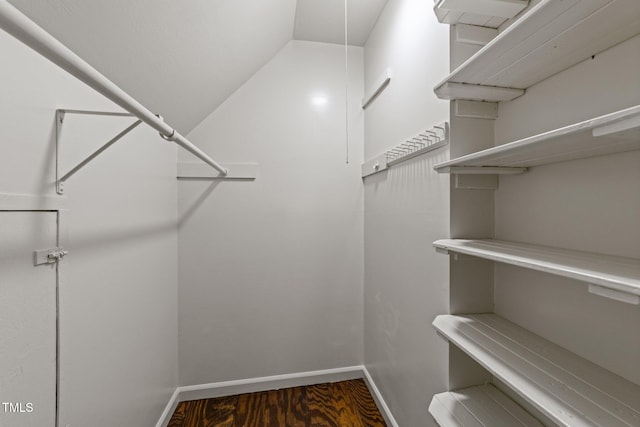 3309 Bearskin Ct, Raleigh, NC 27606 - spacious closet featuring lofted ceiling and wood finished floors
