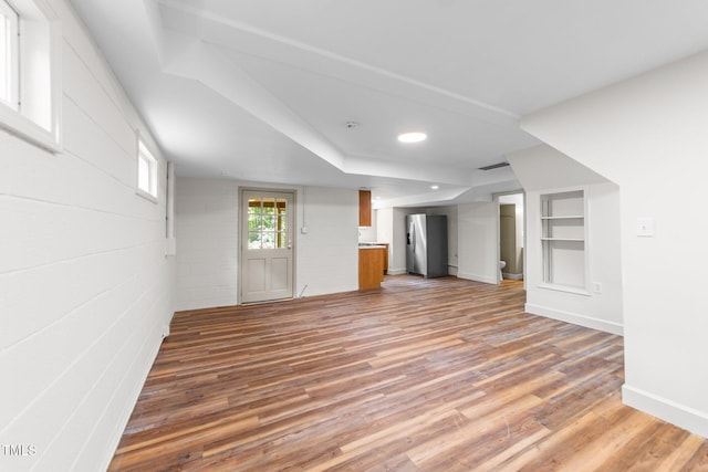 3309 Bearskin Ct, Raleigh, NC 27606 - unfurnished living room with light wood-style floors, recessed lighting, and built in features