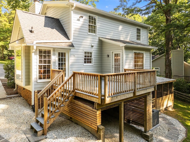 3309 Bearskin Ct, Raleigh, NC 27606 - back of property featuring a chimney, a deck, and roof with shingles
