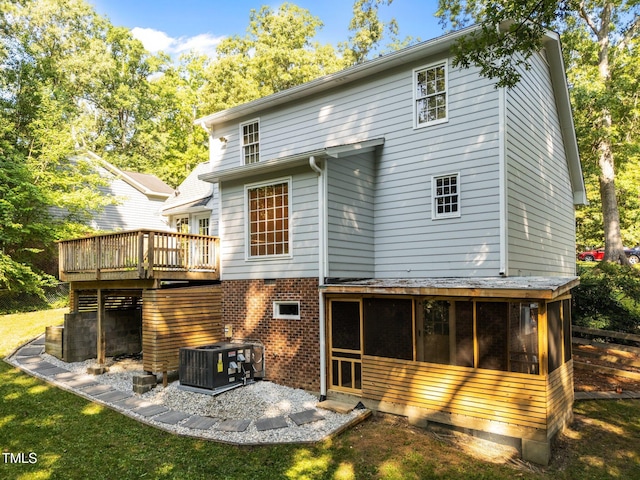 3309 Bearskin Ct, Raleigh, NC 27606 - rear view of house with a deck, a sunroom, and a patio area
