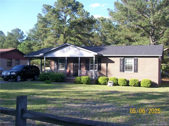 5212 Delco St, Fayetteville, NC 28311 - ranch-style house featuring covered porch, brick siding, and a front yard