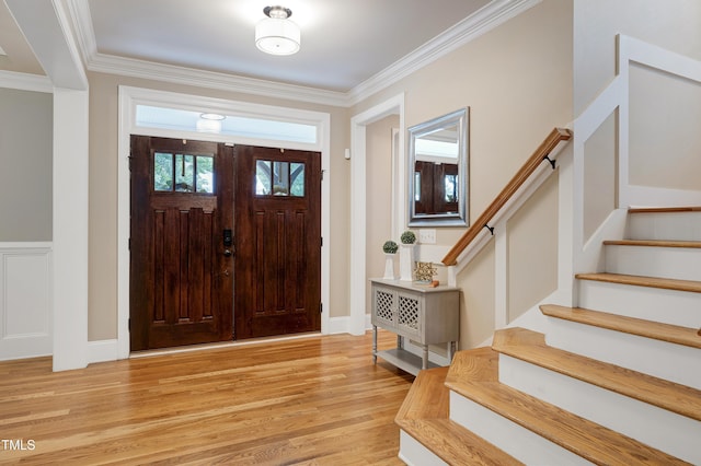 1013 Shasta Daisy Dr, Wake Forest, NC 27587 - foyer with stairway, light wood finished floors, and crown molding