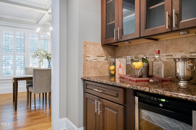 1013 Shasta Daisy Dr, Wake Forest, NC 27587 - bar area featuring crown molding, beverage cooler, backsplash, and light wood-type flooring
