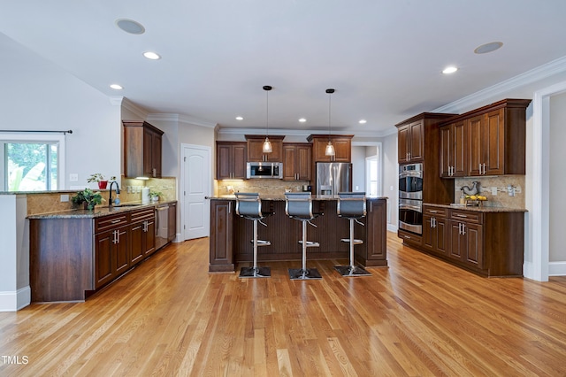 1013 Shasta Daisy Dr, Wake Forest, NC 27587 - kitchen featuring stainless steel appliances, a breakfast bar, decorative backsplash, light wood finished floors, and recessed lighting