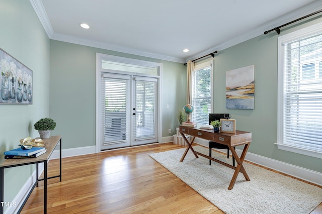 1013 Shasta Daisy Dr, Wake Forest, NC 27587 - office area with crown molding, wood finished floors, french doors, and recessed lighting
