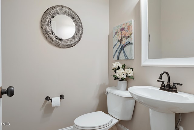 1013 Shasta Daisy Dr, Wake Forest, NC 27587 - half bathroom featuring toilet and baseboards