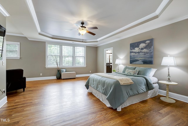1013 Shasta Daisy Dr, Wake Forest, NC 27587 - bedroom with a raised ceiling, wood finished floors, crown molding, and ceiling fan