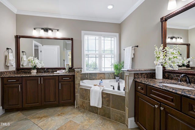 1013 Shasta Daisy Dr, Wake Forest, NC 27587 - bathroom featuring a garden tub, two vanities, and ornamental molding