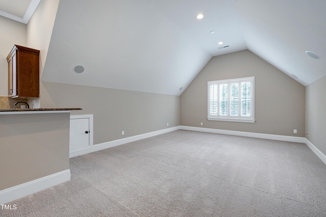 1013 Shasta Daisy Dr, Wake Forest, NC 27587 - additional living space featuring light colored carpet, vaulted ceiling, and recessed lighting