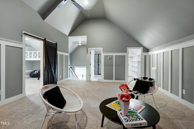 1013 Shasta Daisy Dr, Wake Forest, NC 27587 - living area featuring carpet floors, high vaulted ceiling, a ceiling fan, and a barn door