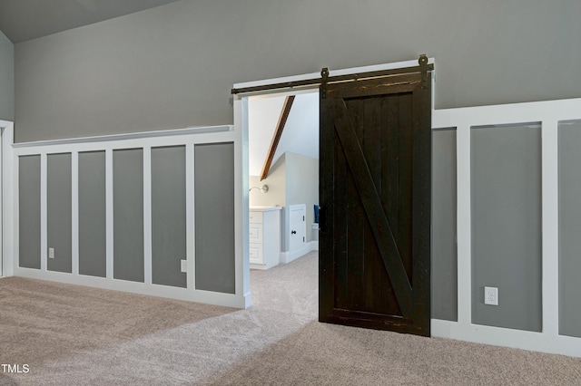 1013 Shasta Daisy Dr, Wake Forest, NC 27587 - additional living space with carpet flooring and a barn door