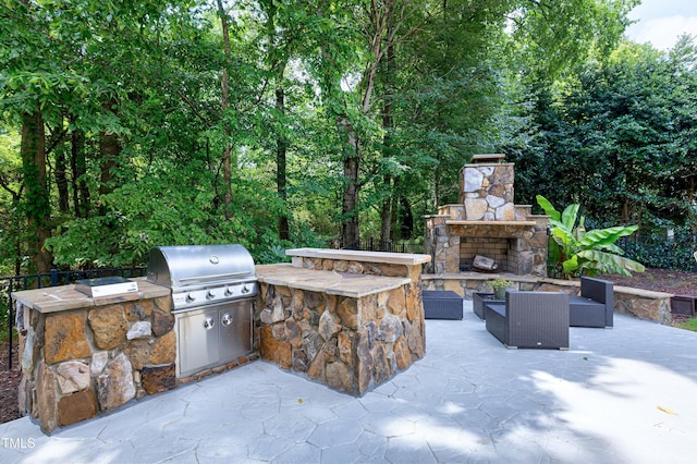 1013 Shasta Daisy Dr, Wake Forest, NC 27587 - view of patio / terrace with area for grilling and an outdoor living space with a fireplace