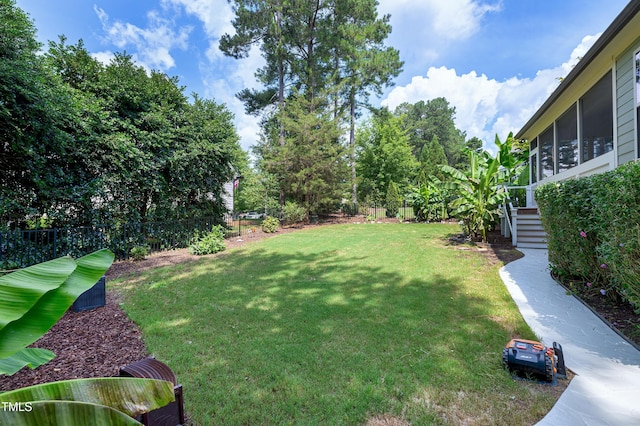 1013 Shasta Daisy Dr, Wake Forest, NC 27587 - fenced backyard with a sunroom