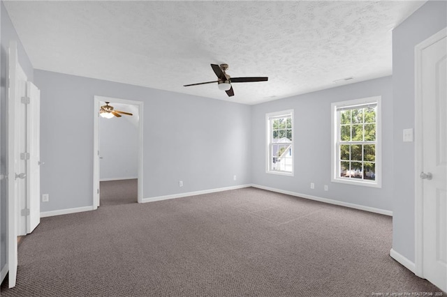 2505 Canford Ln, Fayetteville, NC 28304 - empty room with a ceiling fan, carpet, and a textured ceiling