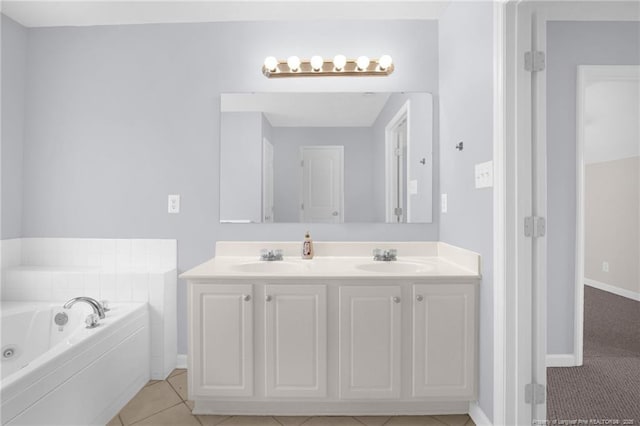 2505 Canford Ln, Fayetteville, NC 28304 - bathroom with double vanity, a tub with jets, and tile patterned flooring